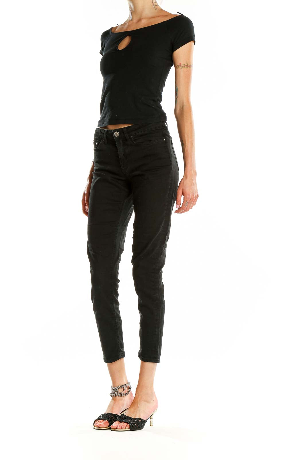 Front view of Acne black slim-fit cropped jeans on model