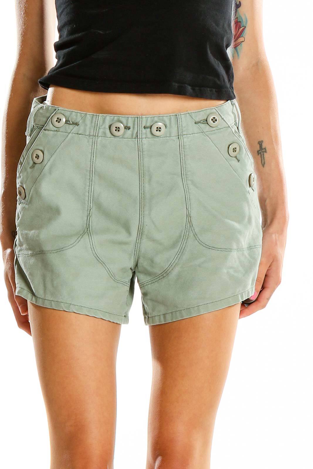 Front view of sage green Obey shorts with button-detail waistband