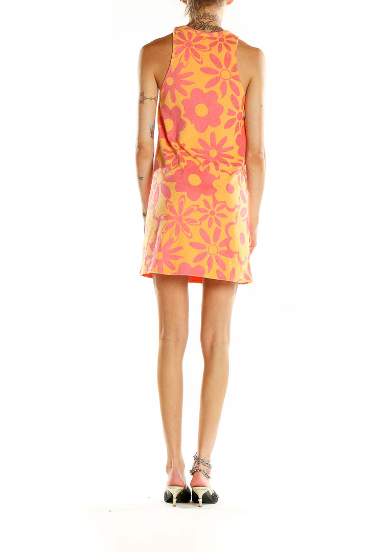 Back view of orange Zara mini dress showing all-over pink floral pattern