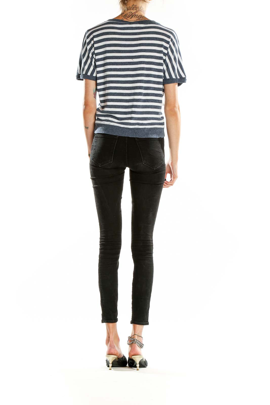 Back view of Rachel Zoe navy and white striped short-sleeve top with black jeans