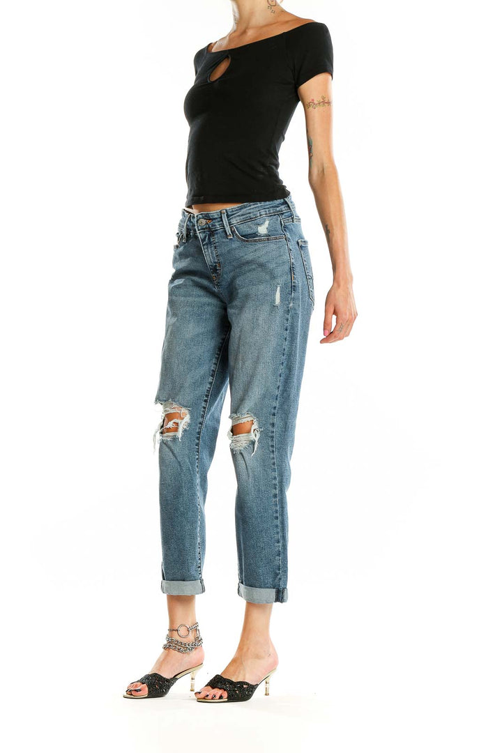 Front view of DENIZEN from Levi's blue distressed boyfriend jeans with knee rips