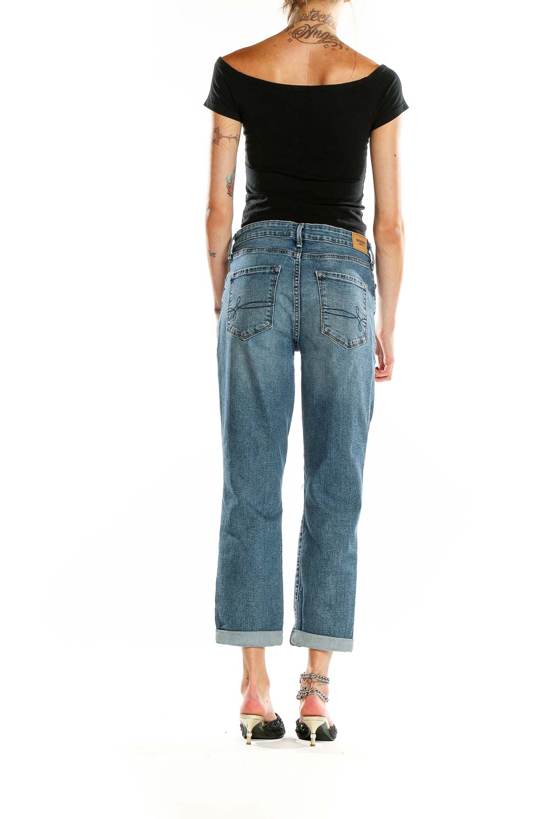 Back view of DENIZEN from Levi's blue distressed boyfriend jeans showing pocket design