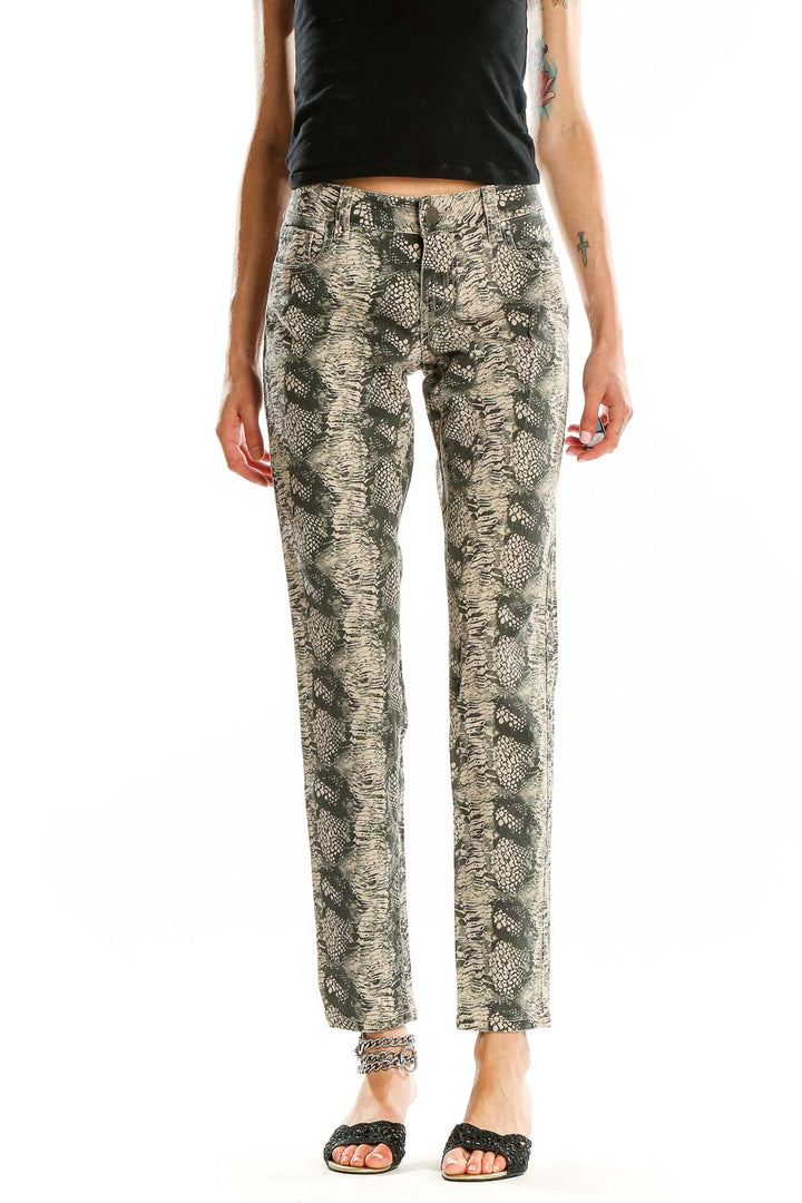 Front view of Cabi beige snake print skinny jeans on model