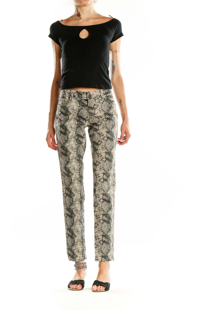 Front view of Cabi beige snake print skinny jeans on model