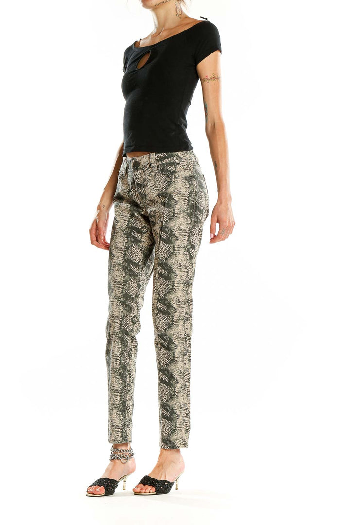 Front view of Cabi beige snake print skinny jeans on model