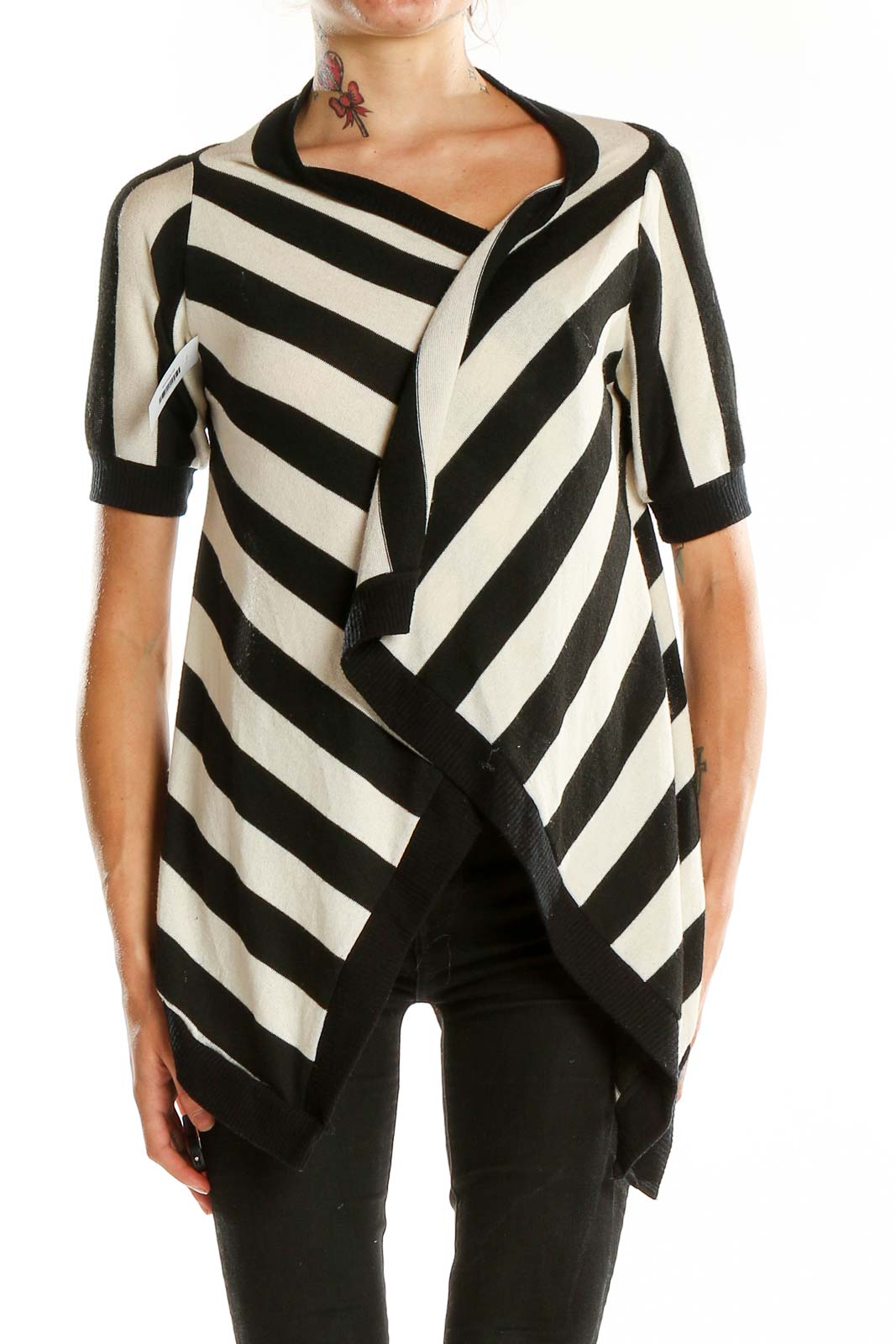 Front view of Silence + Noise Black and White Striped Asymmetrical Knit Top