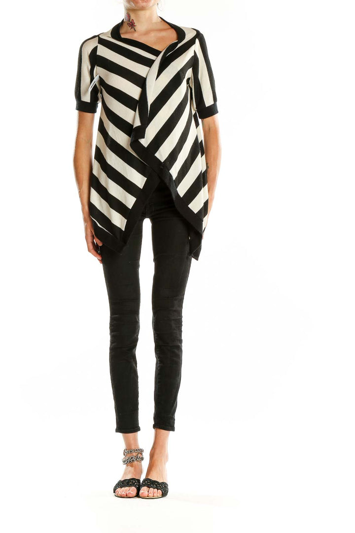 Front view of Silence + Noise Black and White Striped Asymmetrical Knit Top