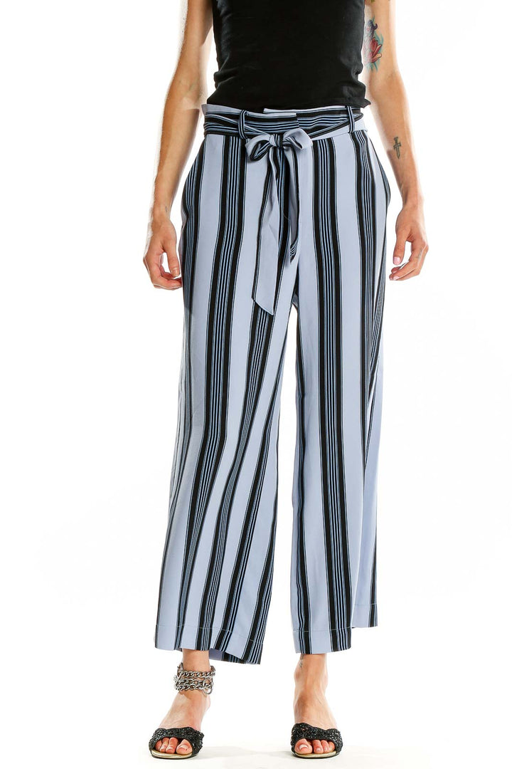 Front view of Ann Taylor LOFT blue striped wide-leg trousers with paper bag waist and self-tie belt