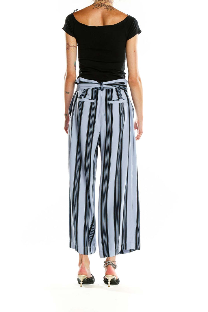 Back view of Ann Taylor LOFT blue striped wide-leg trousers showing rear pockets and fit