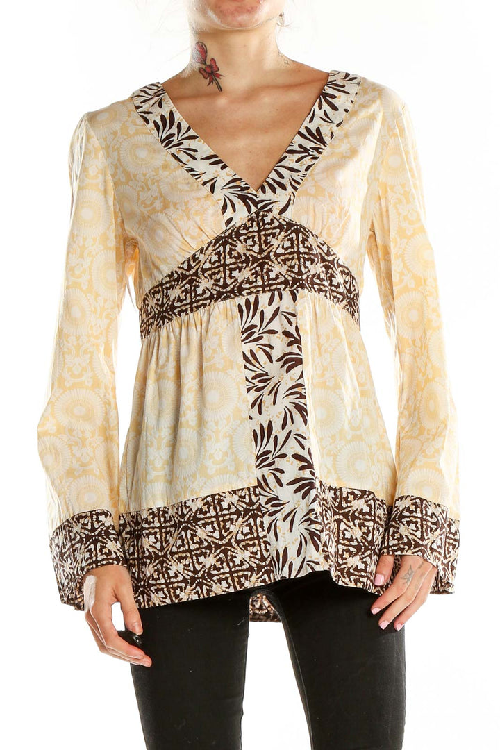 Front view of cream floral print MICHAEL Michael Kors tunic with V-neckline and empire waist