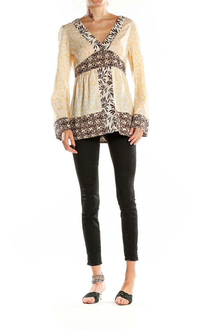 Front view of cream floral print MICHAEL Michael Kors tunic with V-neckline and empire waist