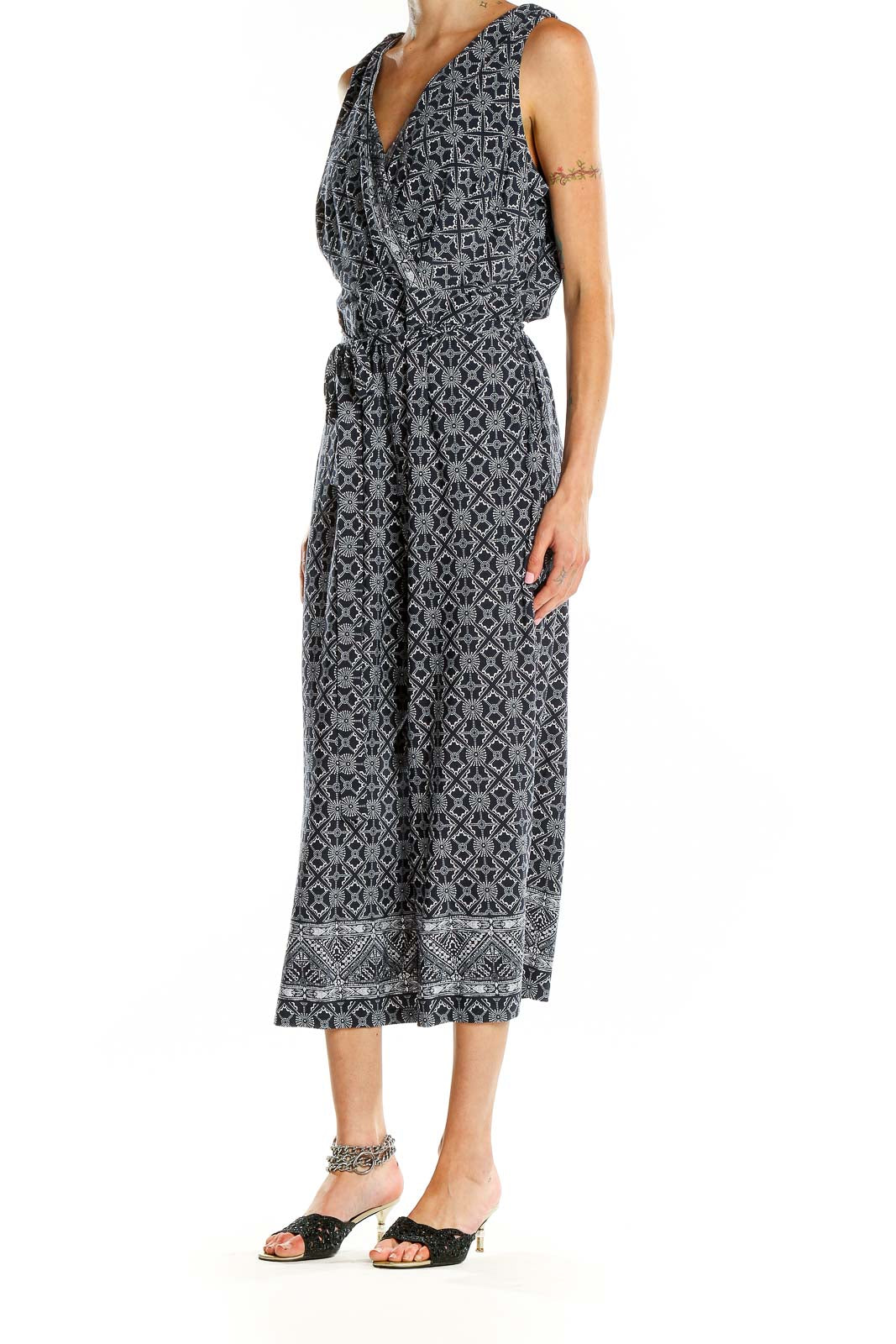 Front view of SANDRA DARREN black and white geometric print jumpsuit with V-neck and cropped wide legs