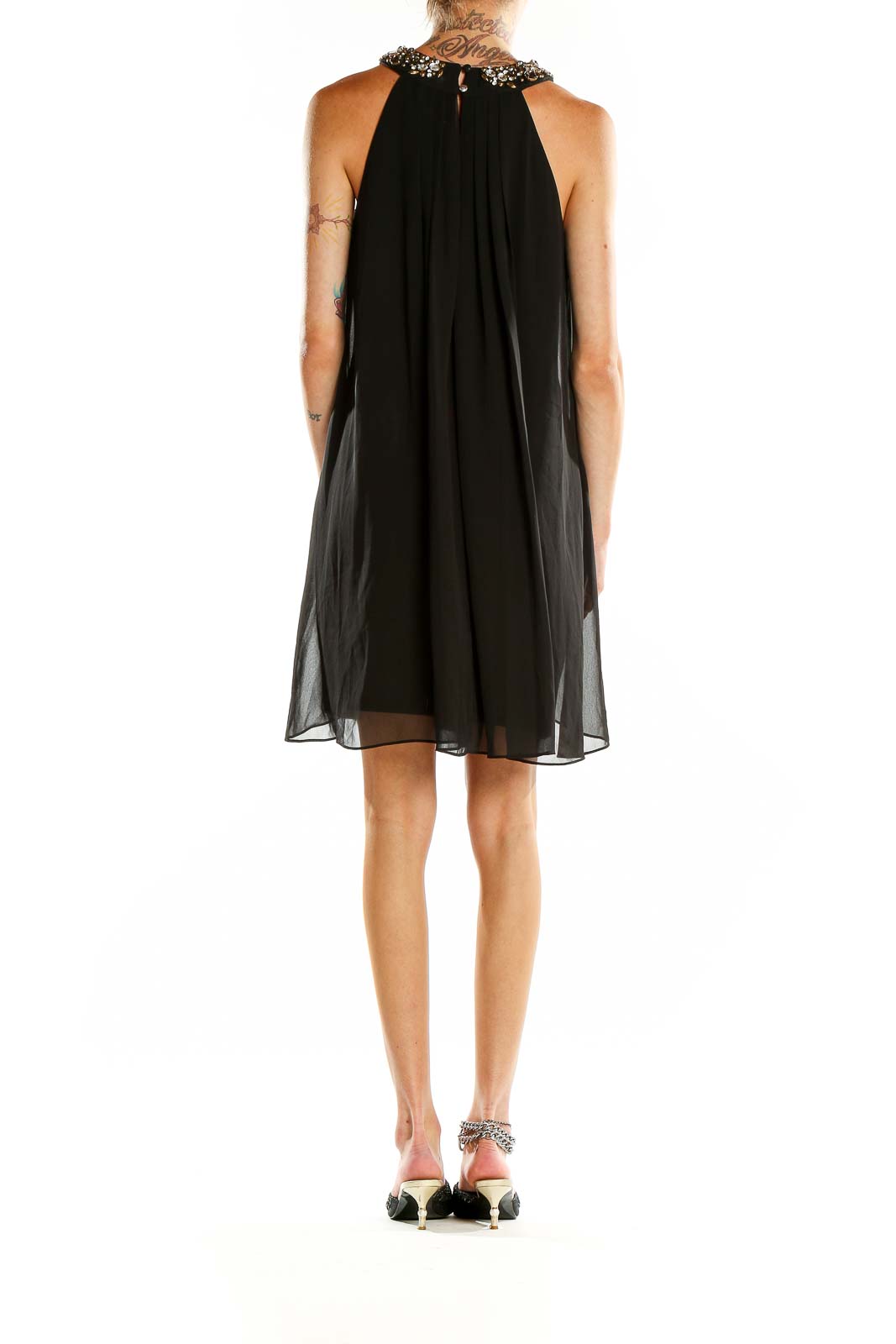 Back view of Vince Camuto black chiffon cocktail dress showing open back design