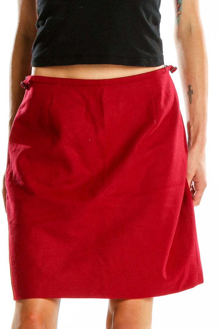 Front view of Ann Taylor red A-line skirt with side tie detail