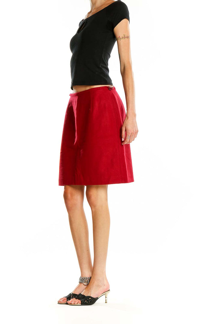 Front view of Ann Taylor red A-line skirt with side tie detail