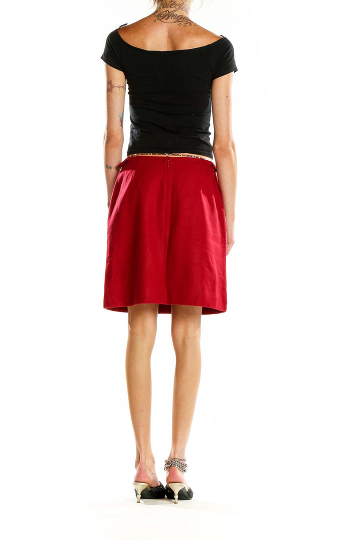 Back view of Ann Taylor red A-line skirt showing smooth silhouette