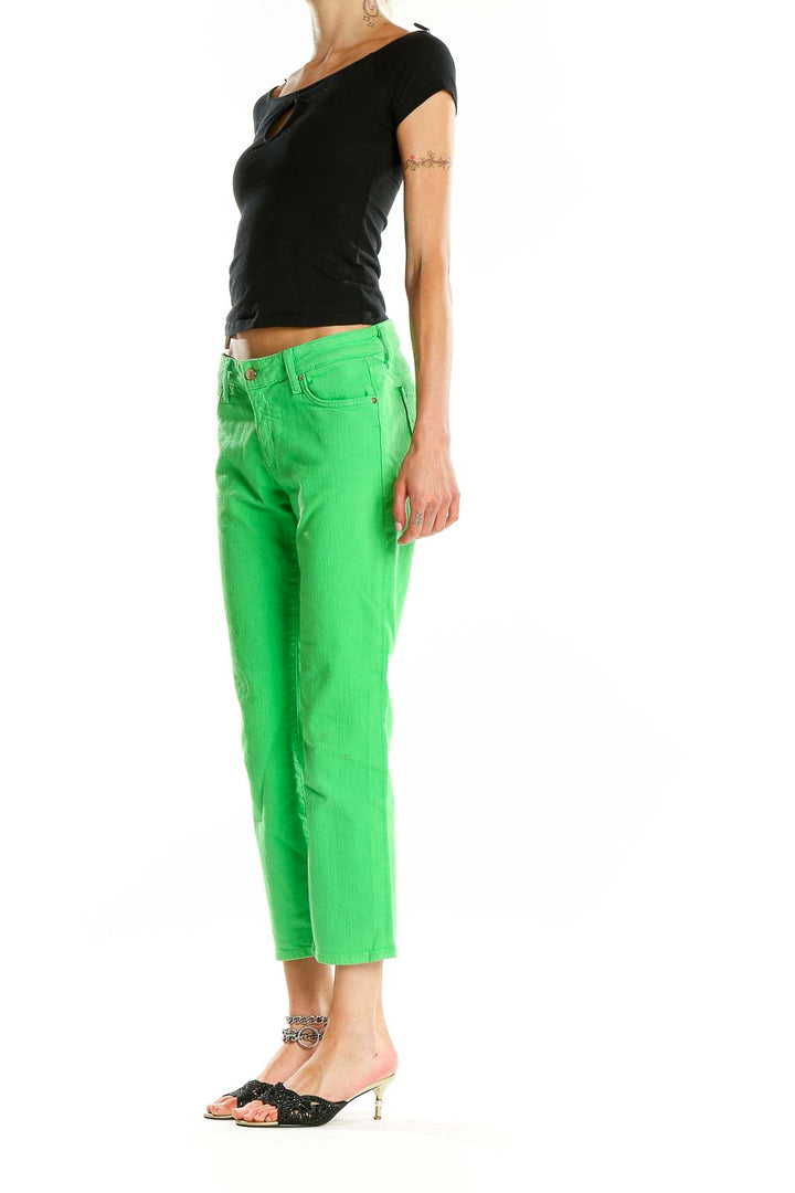 Front view of Kate Spade green cropped denim jeans on model