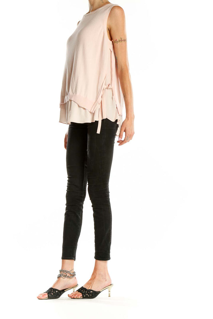 Front view of LOFT blush layered sleeveless top with side ties