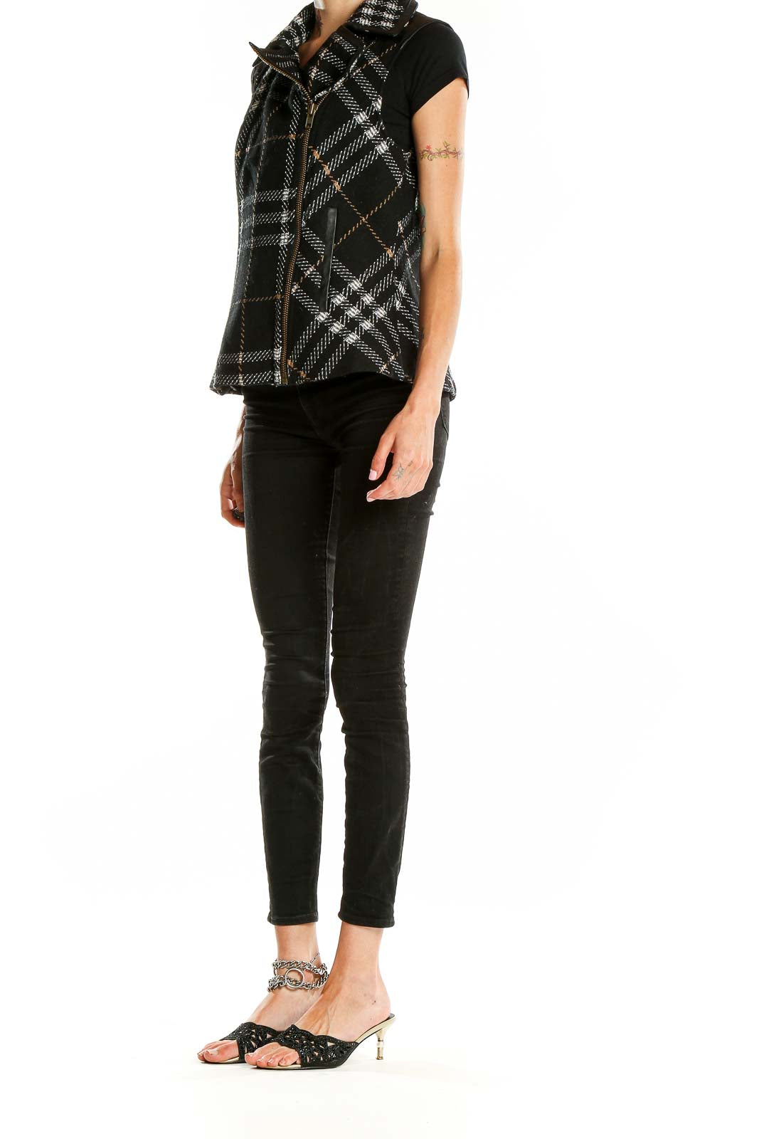 Front view of Cabi Black Plaid Asymmetrical Zip Vest on model