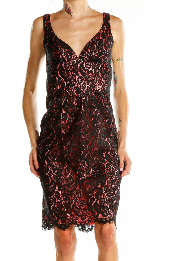 Front view of Trina Turk black and red lace cocktail dress with V-neckline