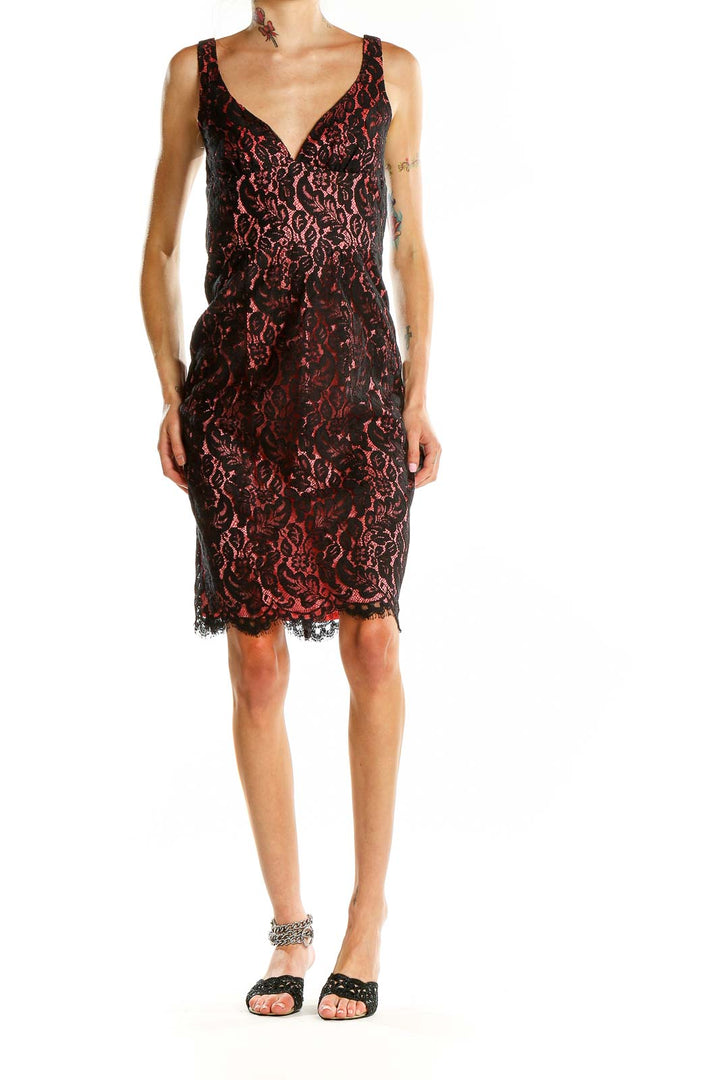 Front view of Trina Turk black and red lace cocktail dress with V-neckline