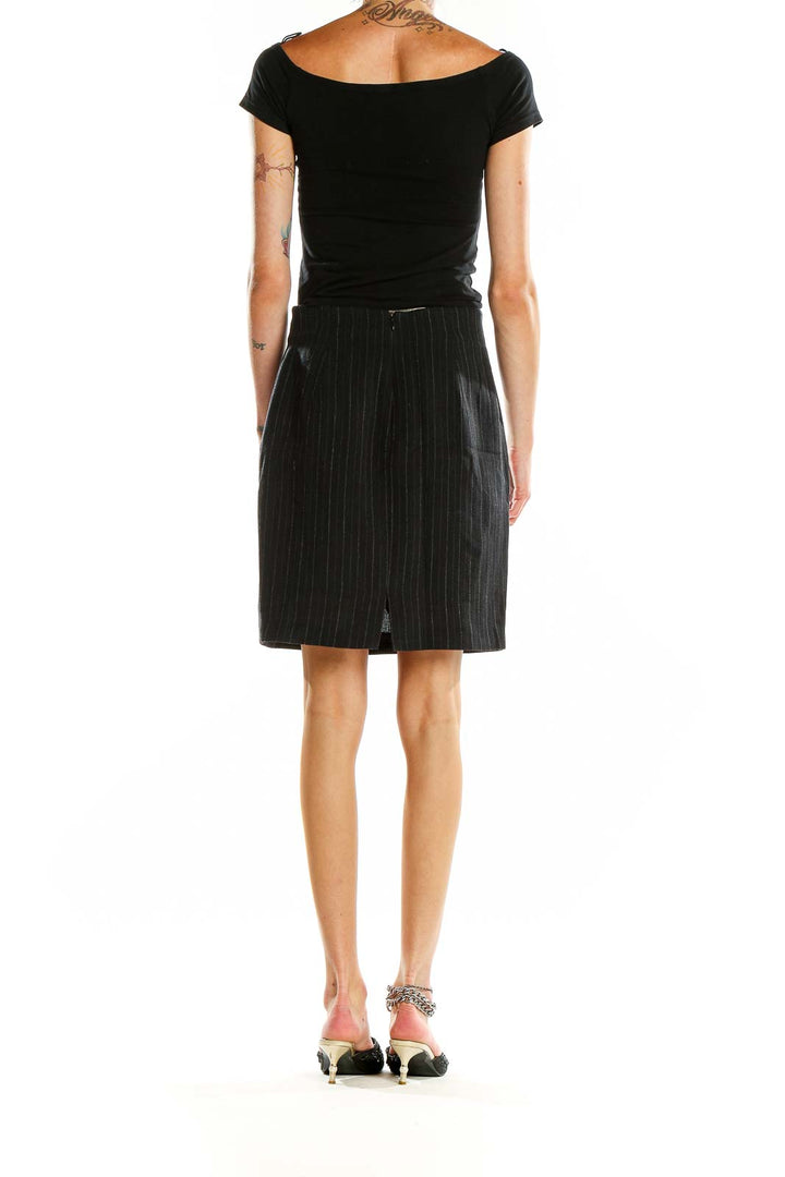 Back view of Ralph by Ralph Lauren black pinstripe pencil skirt on model