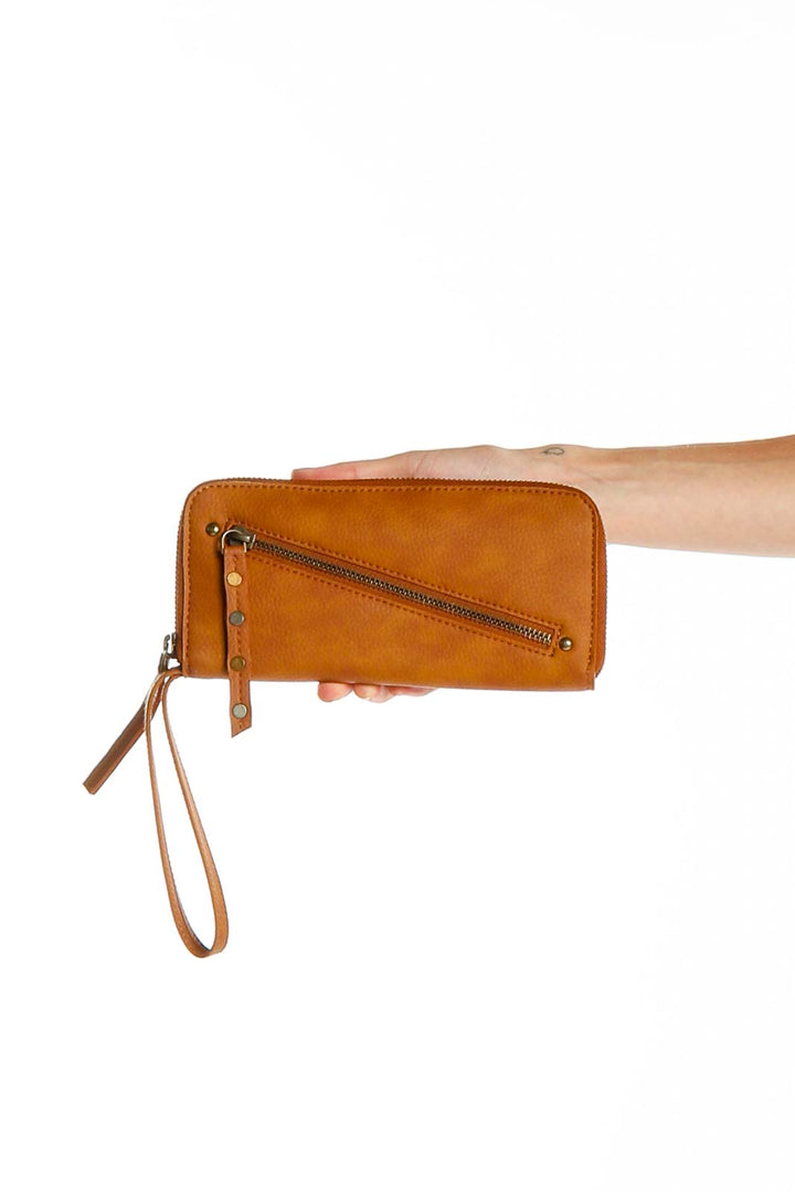 Tan vegan leather zip clutch from Free People, front view