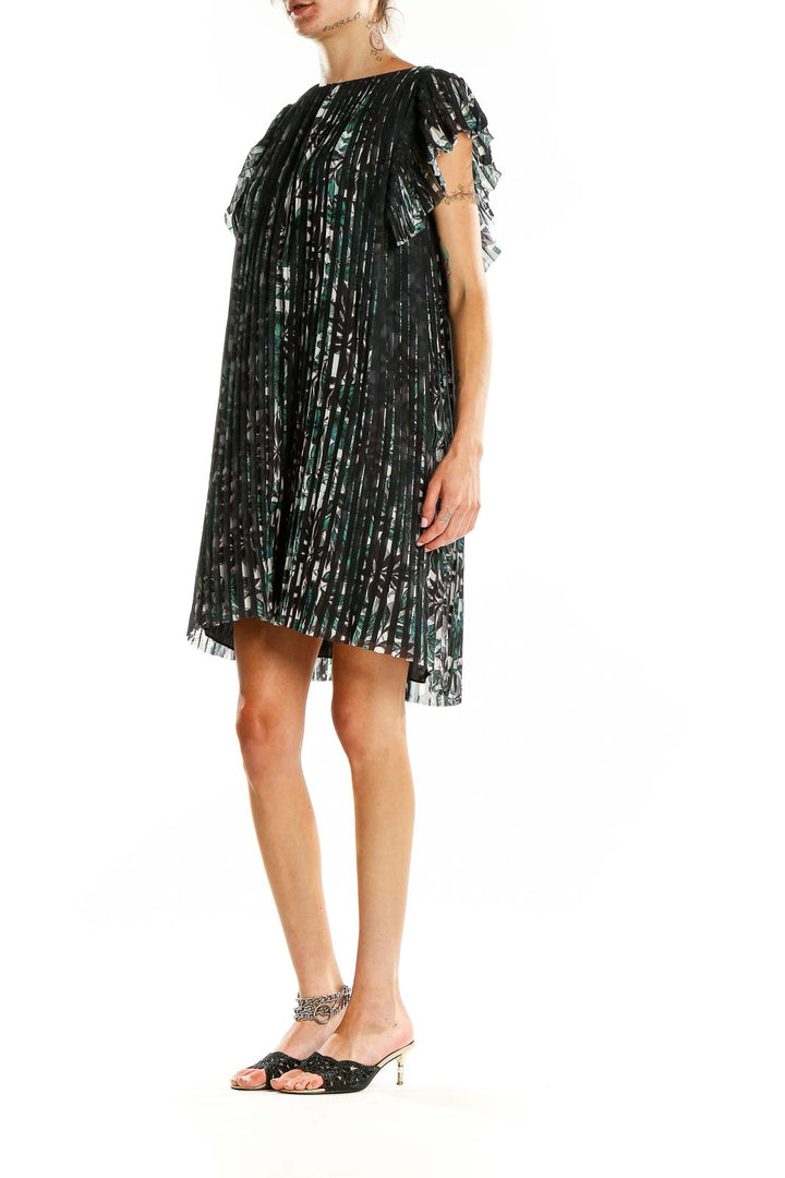 Front view of Max Studio black floral pleated cocktail dress with cap sleeves