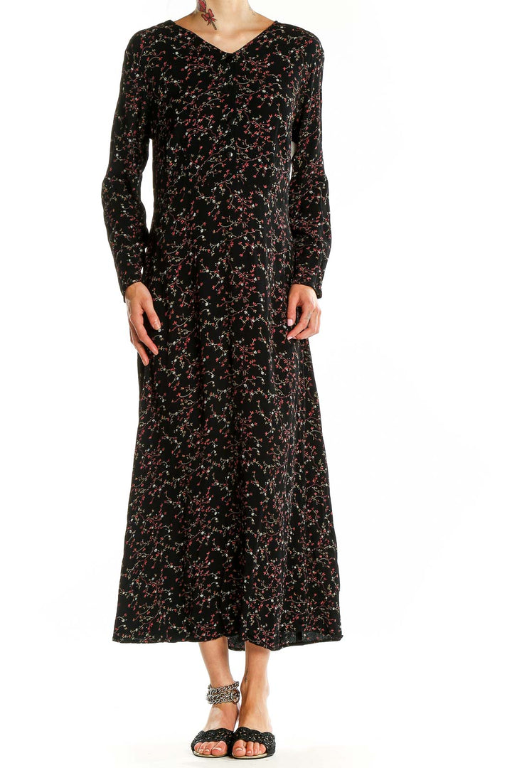 Front view of Putumayo black floral print rayon maxi dress with long sleeves