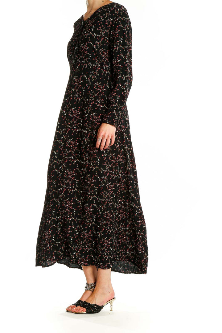 Front view of Putumayo black floral print rayon maxi dress with long sleeves