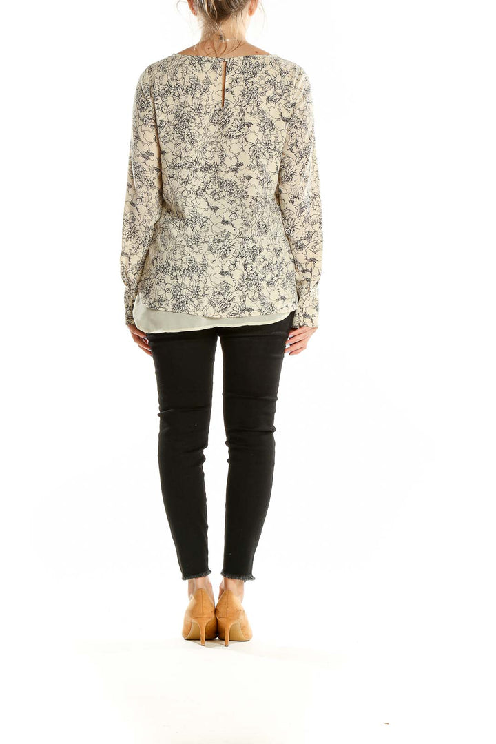 Back view of beige floral print long sleeve blouse from The Limited