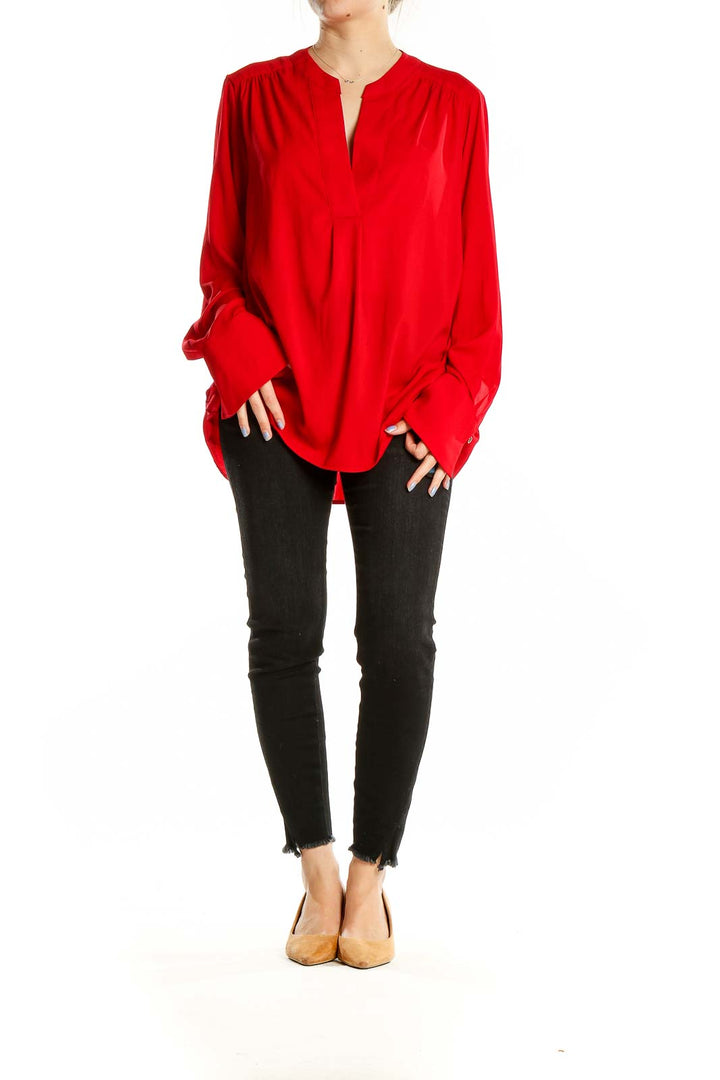 Front view of red Calvin Klein V-neck blouse with long sleeves