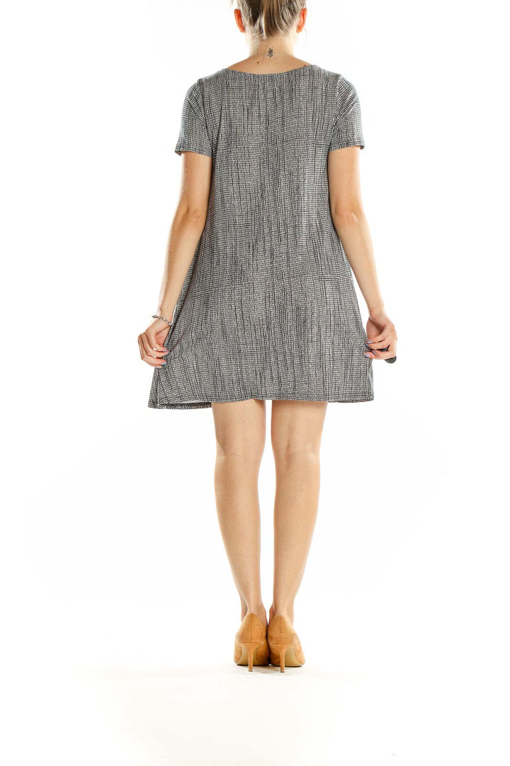 Back view of gray textured short sleeve swing dress by Silence + Noise