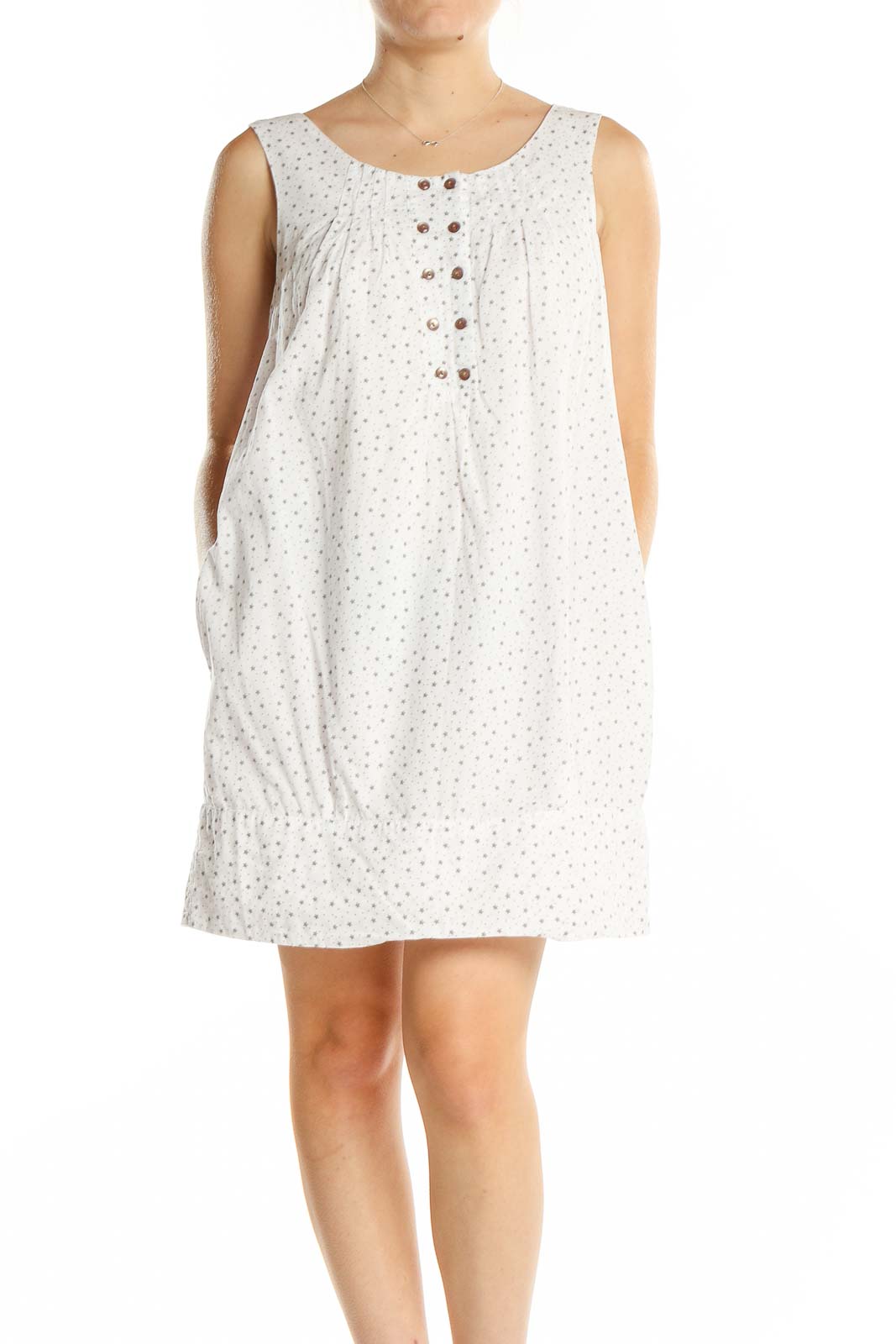 Front view of white polka dot sleeveless cotton dress by Lovestitch