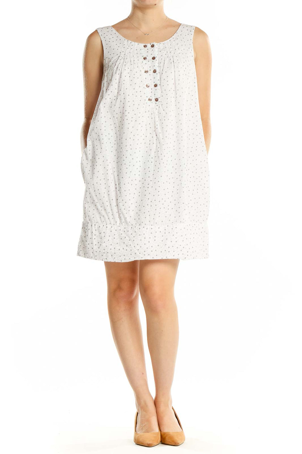 Front view of white polka dot sleeveless cotton dress by Lovestitch