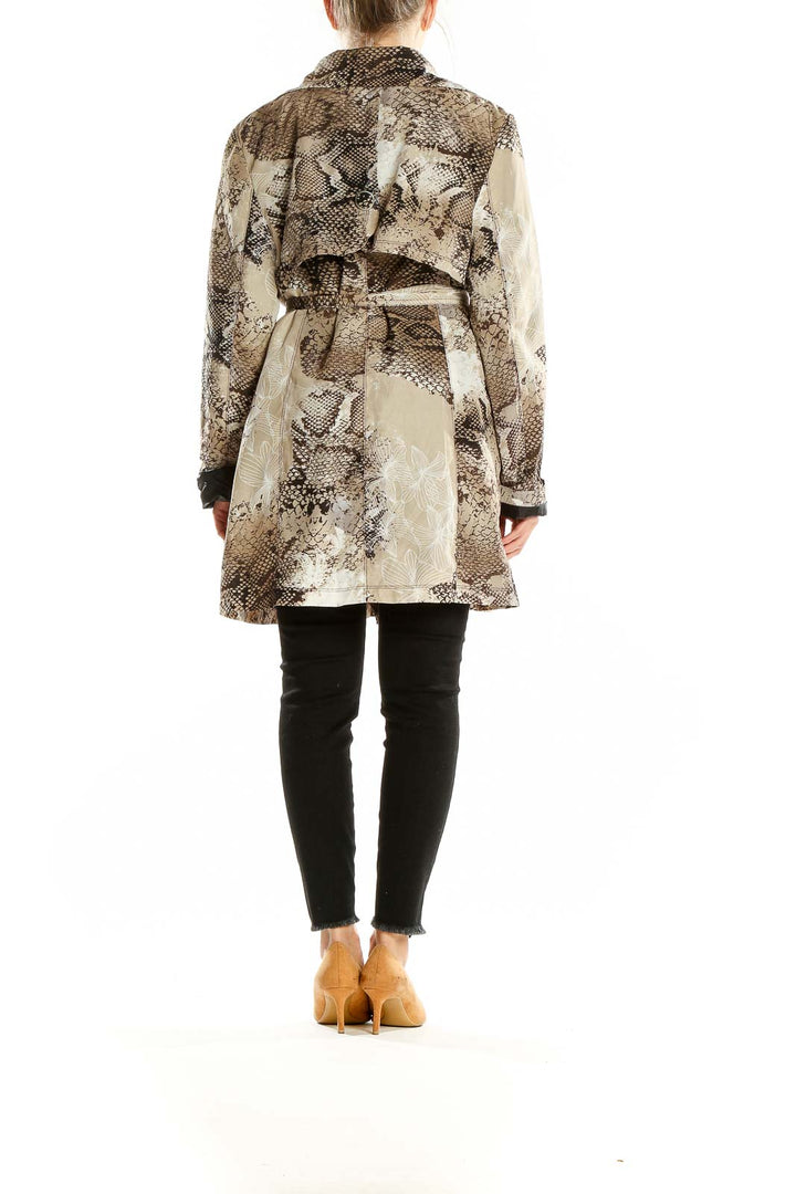 Back view of Vertigo Paris brown snake print trench coat on model