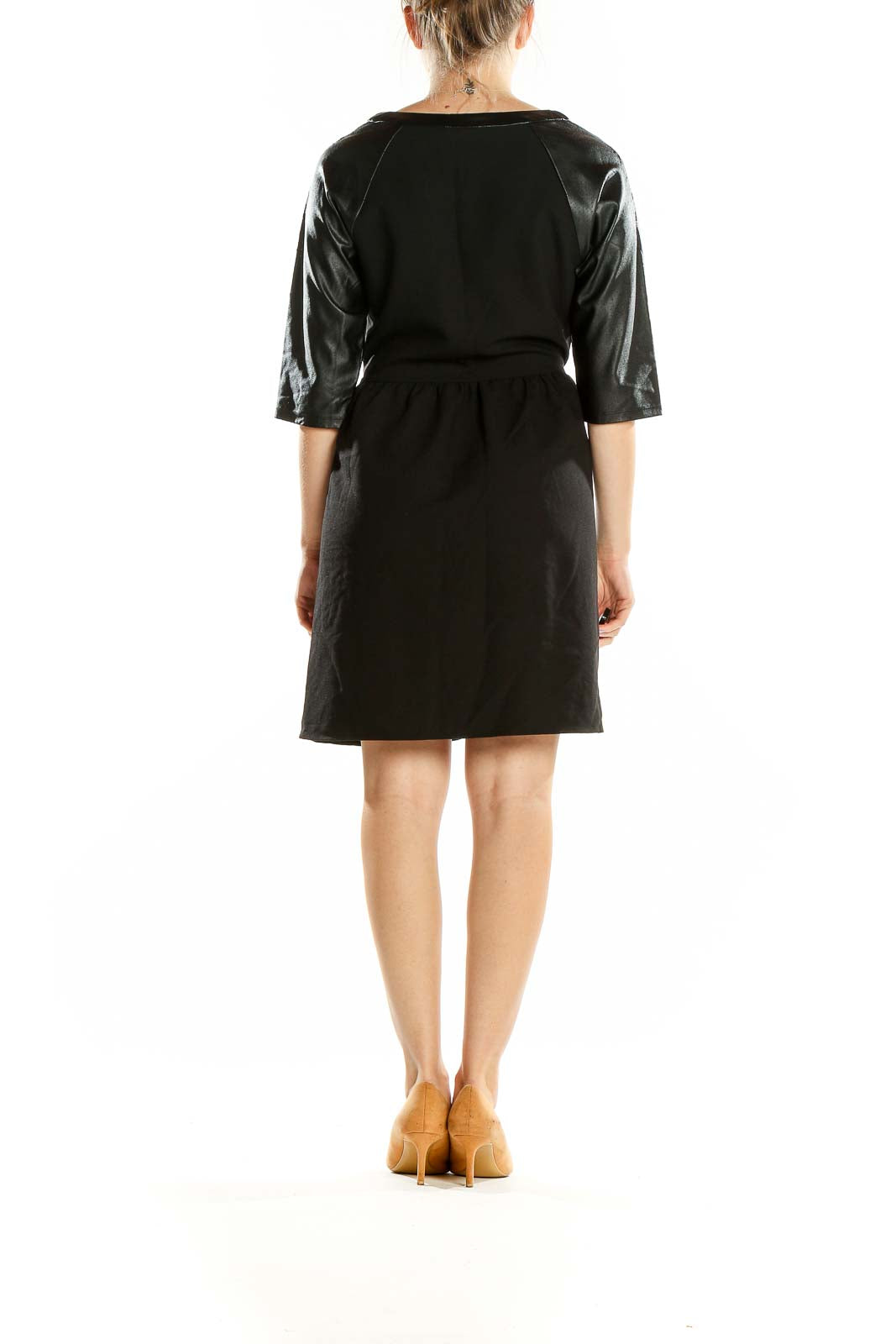 Back view of black fit and flare dress with faux leather sleeves by Romeo & Juliet Couture