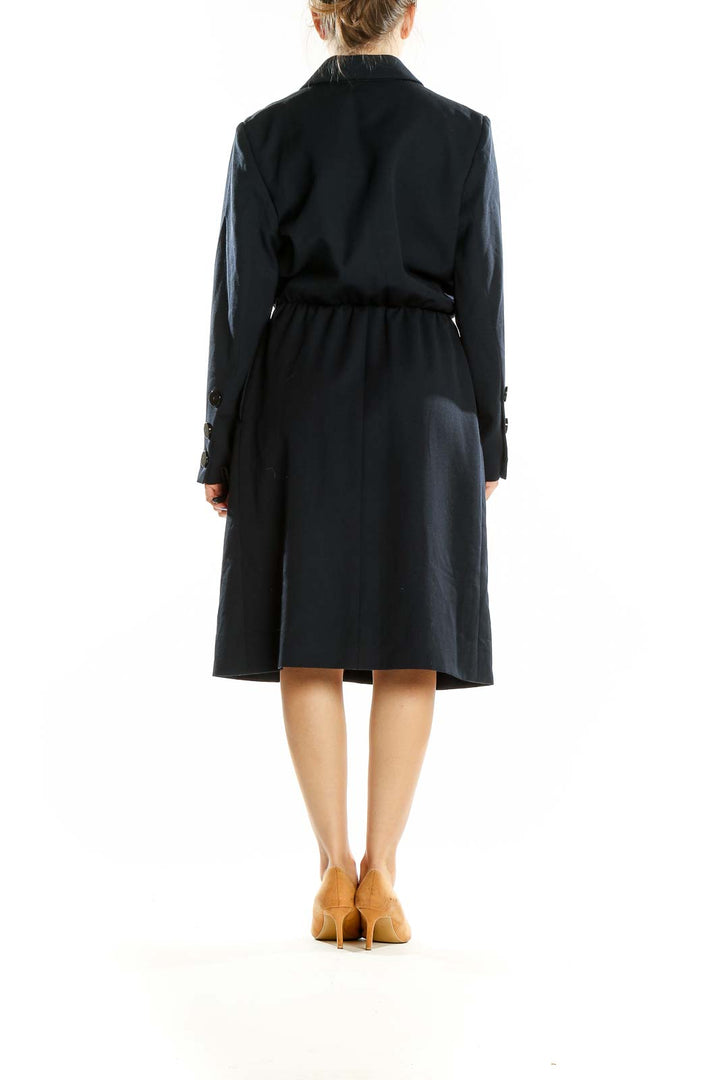 Back view of Yves Saint Laurent black wool midi coat dress showing cinched waist