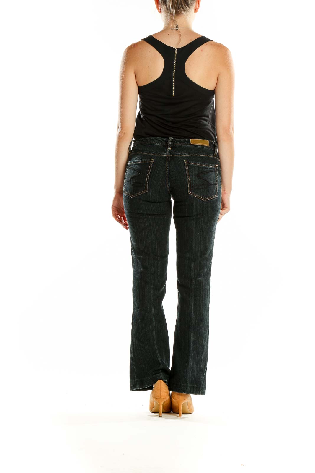 Back view of Seven7 dark blue bootcut jeans on model