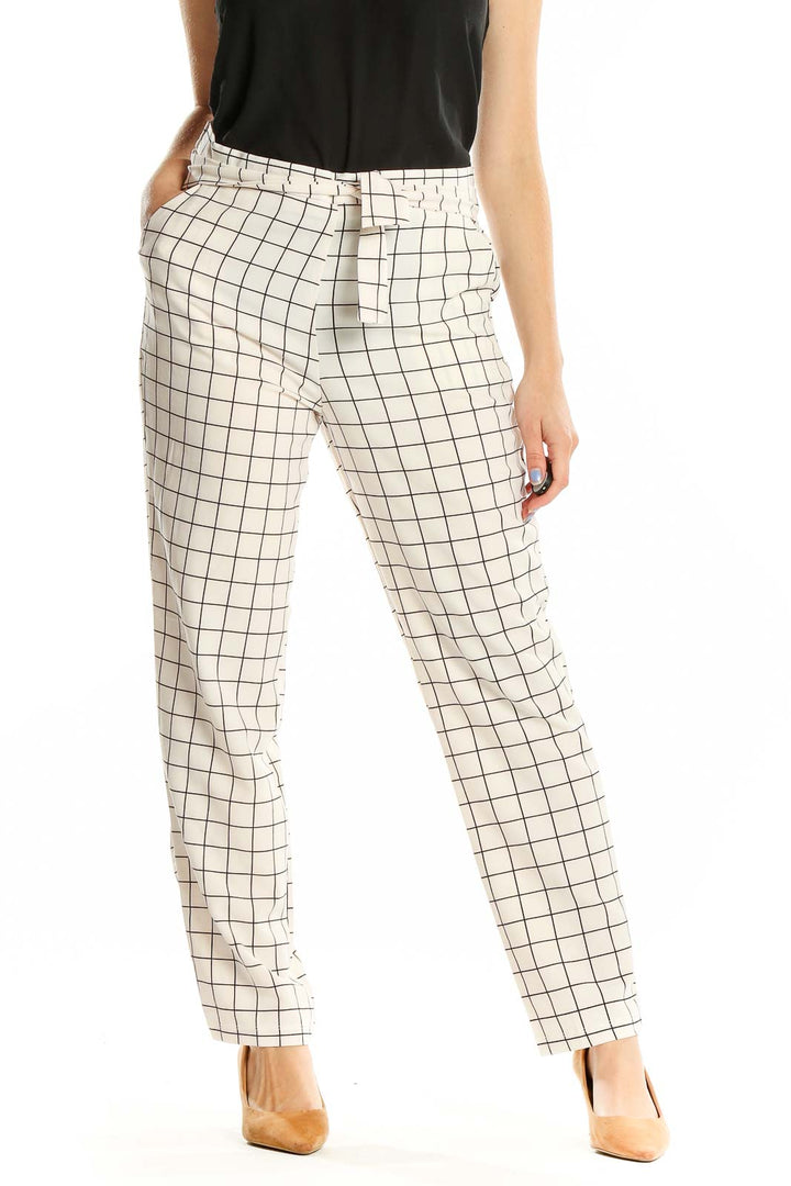 Front view of HAVE white grid pattern pants with straight leg design