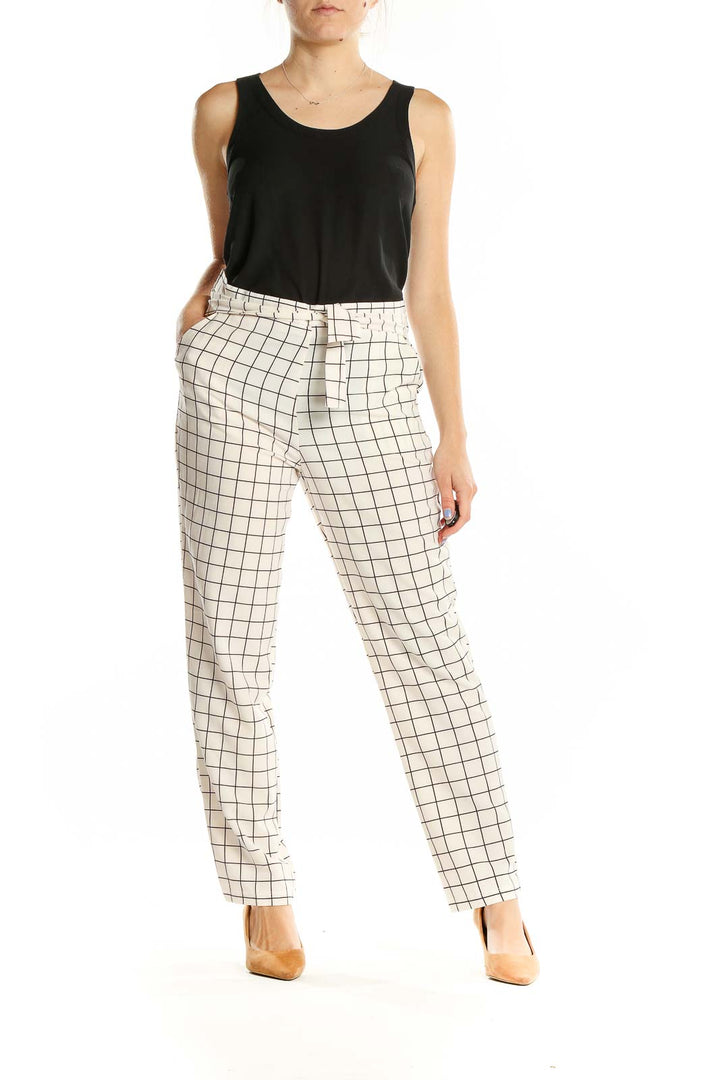 Front view of HAVE white grid pattern pants with straight leg design