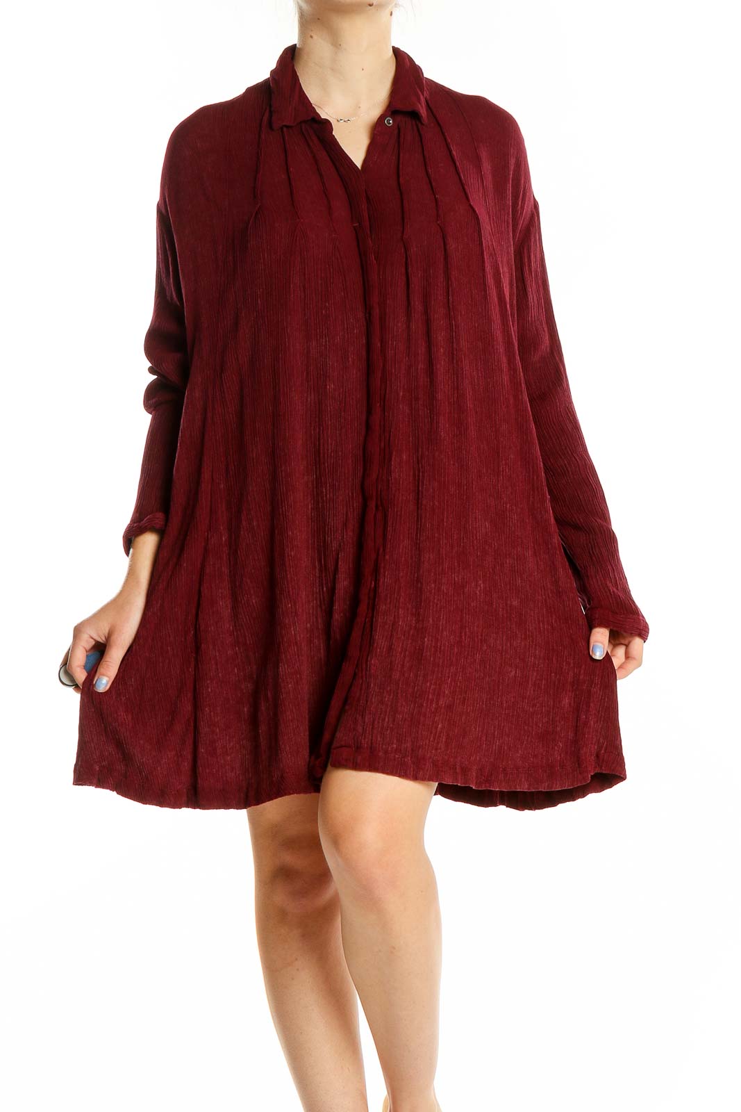 Front view of burgundy Free People flowy shirt dress with button-down front