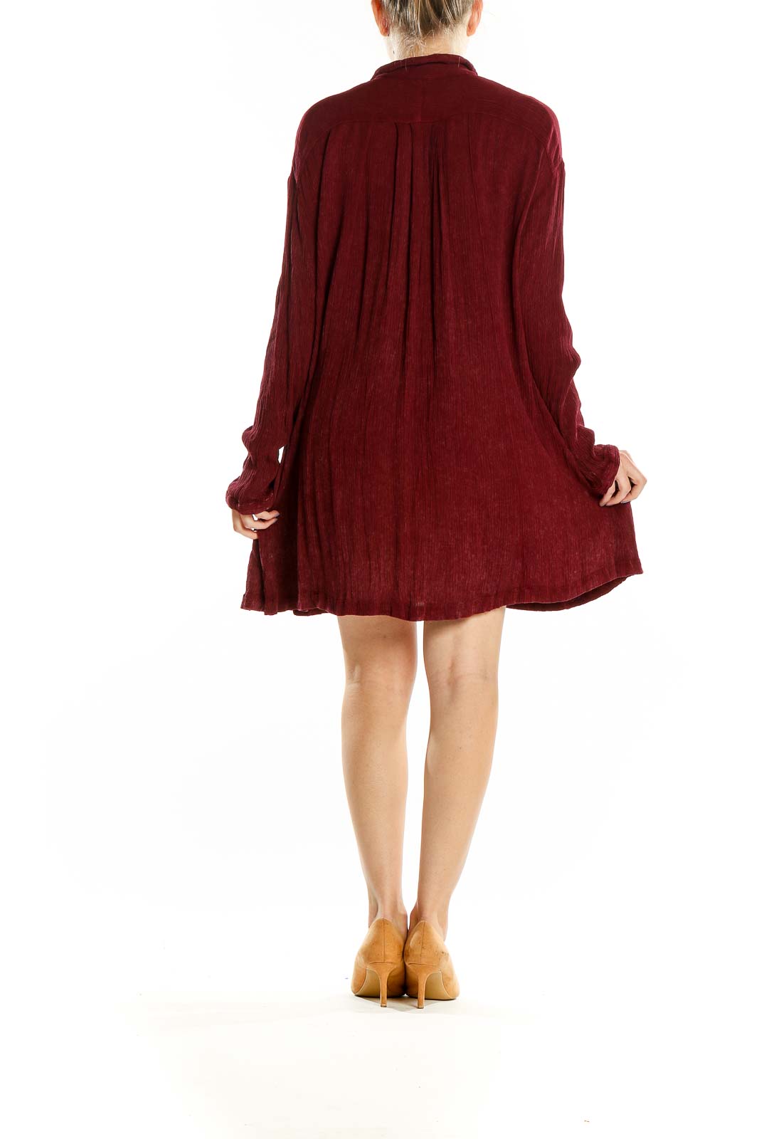 Back view of burgundy Free People flowy shirt dress showing relaxed fit