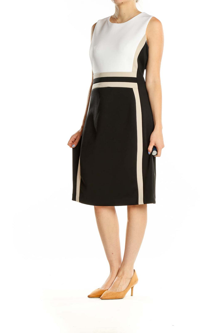 Front view of Calvin Klein black and white color block sheath dress