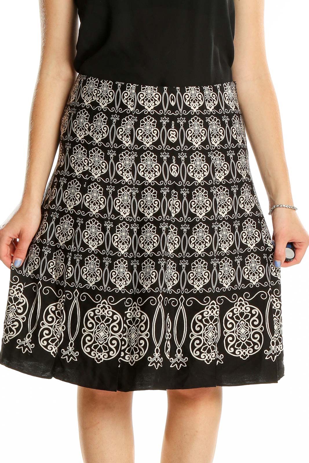 Front view of Ann Taylor black A-line skirt with white embroidery pattern