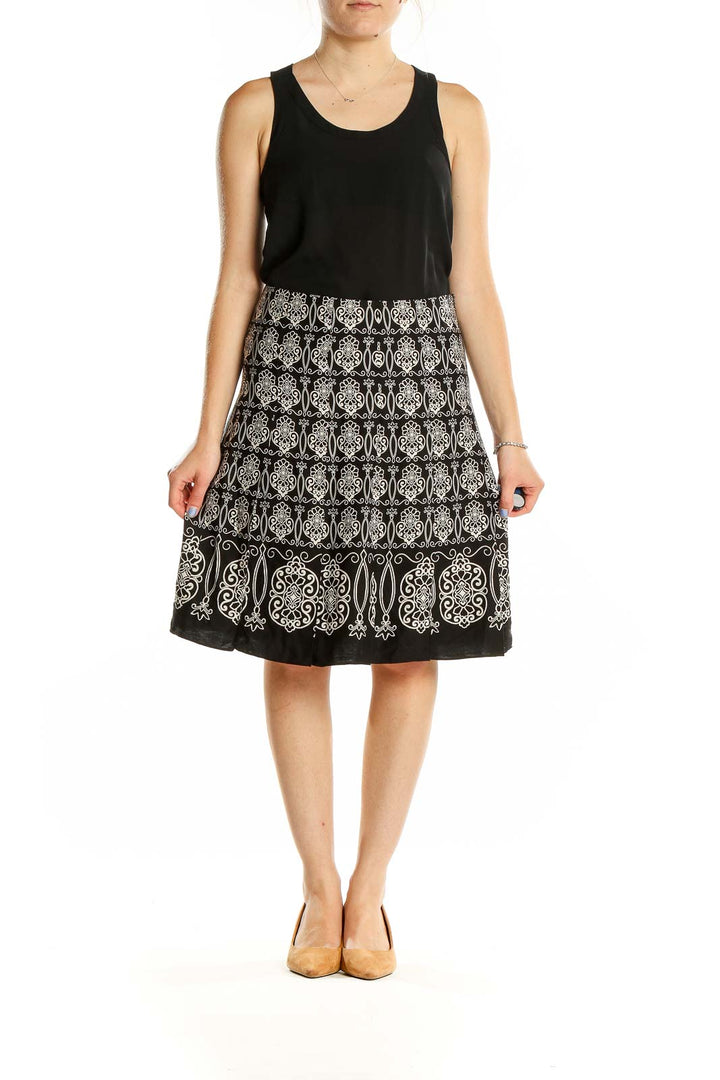 Front view of Ann Taylor black A-line skirt with white embroidery pattern