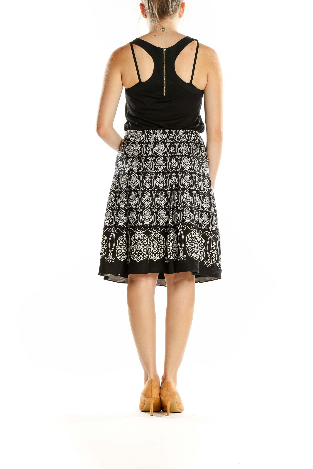 Back view of Ann Taylor black embroidered A-line skirt on model