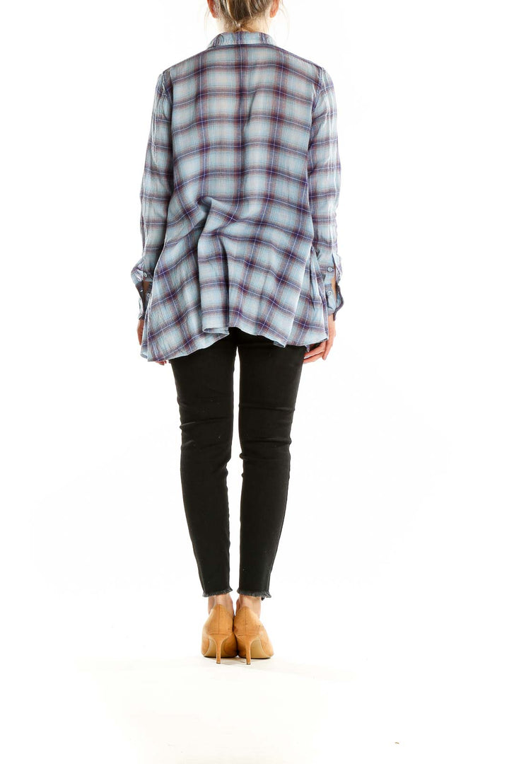 Back view of Free People blue and purple plaid cotton button-up shirt showing longer hem