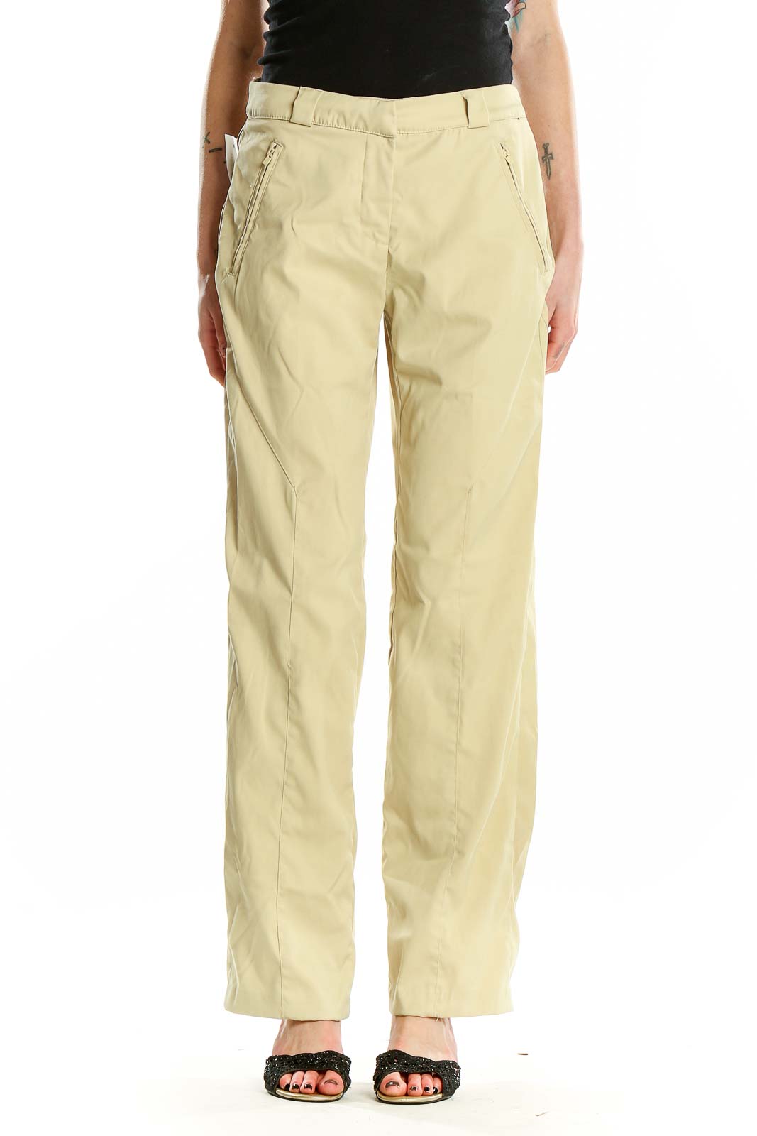 Front view of pale yellow Greg Norman activewear pants with zip pockets