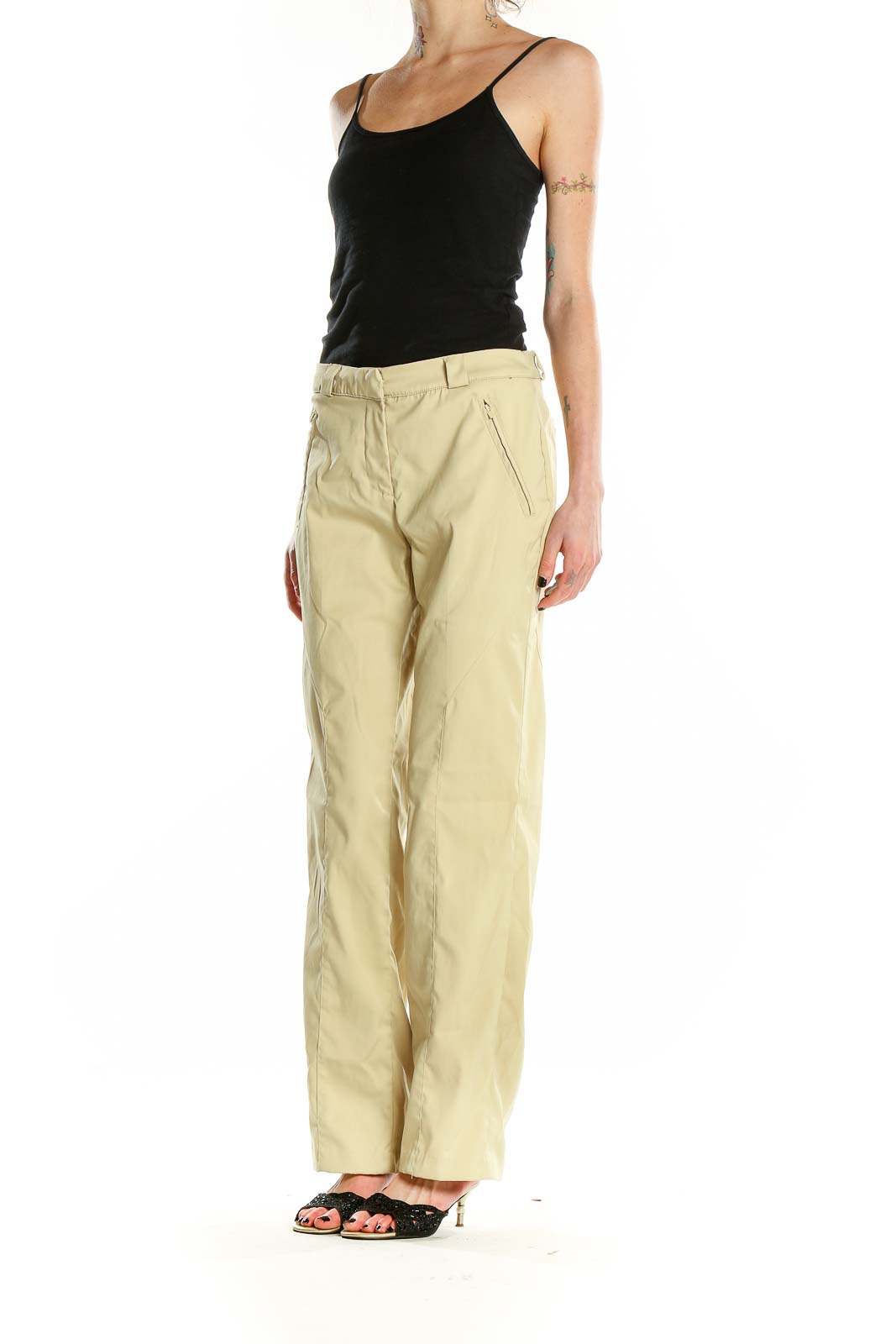 Front view of pale yellow Greg Norman activewear pants with zip pockets